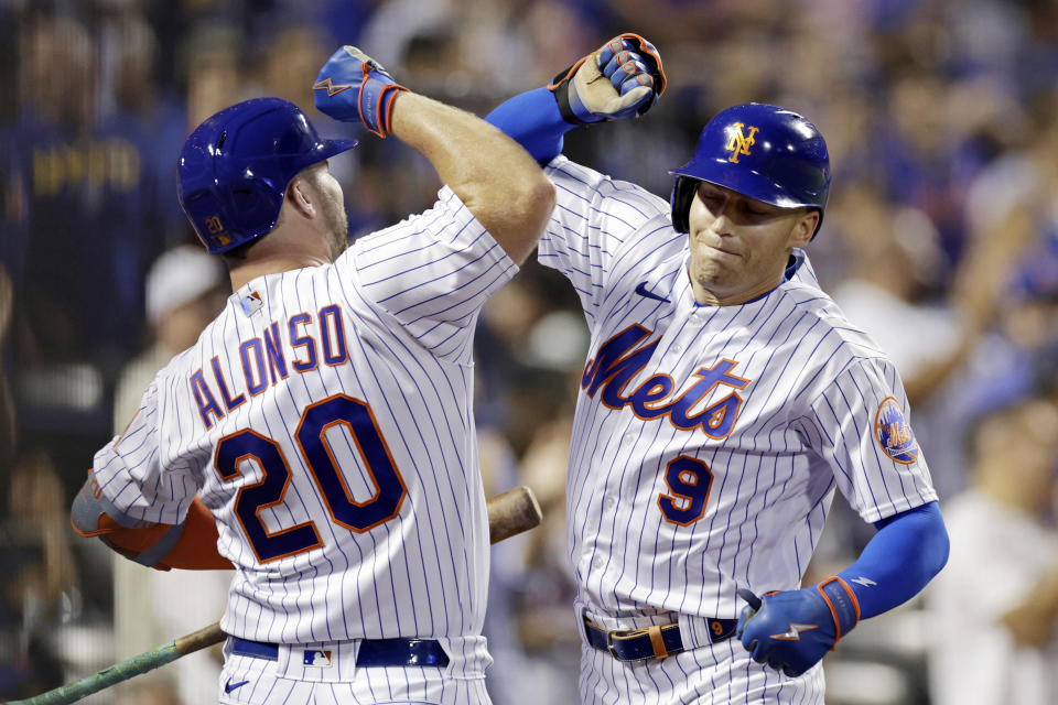 New York Mets' Brandon Nimmo reacts with Pete Alonso after hitting a home run during the first inning of a baseball game against the Colorado Rockies on Saturday, Aug. 27, 2022, in New York. (AP Photo/Adam Hunger)