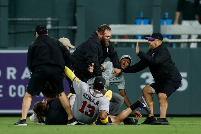 Two fans arrested after rushing Atlanta Braves OF Ronald Acuña Jr. at Coors  Field