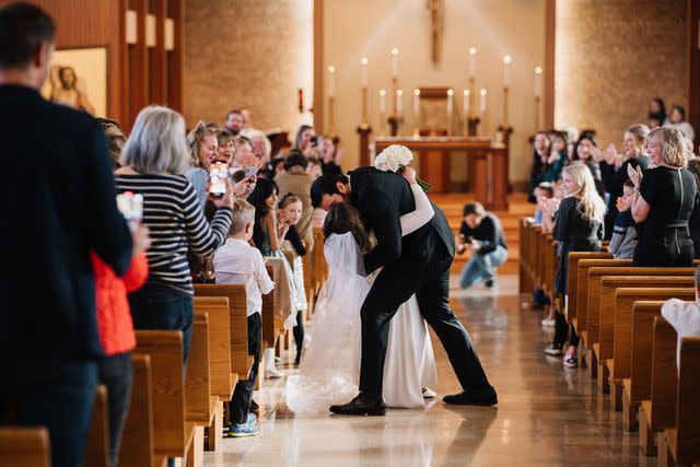 <p>Adam Kennedy Photography</p> Kevin and Catie Zwier share a kiss after saying "I do"