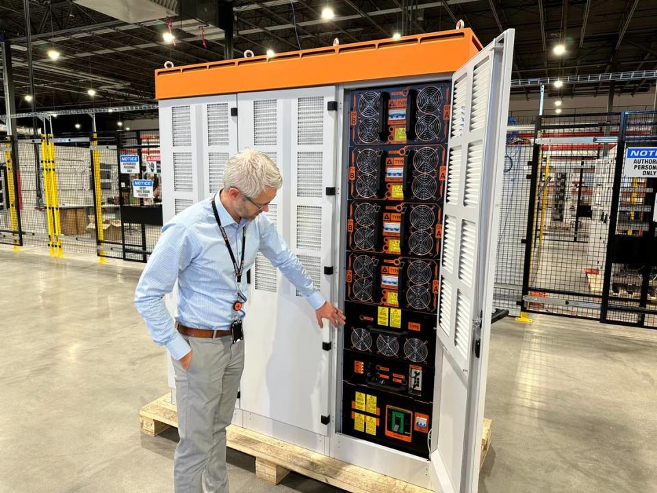 Marcus Suvanto of Kempower shows the inside of a power unit for its electric vehicle charging system at the company’s North American headquarters in Durham. The Finnish company shipped its first charging system made in Durham on Thursday, Dec. 14, to a customer in Edmonton, Canada.