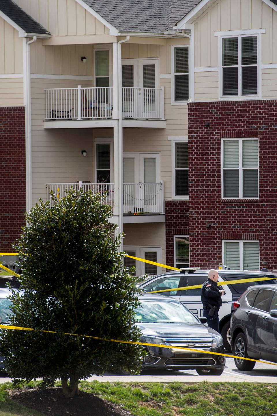 Police investigate the scene at Brittany Place Apartment Homes in Hendersonville, February 23, 2024, after an off-duty Henderson County Sheriff’s deputy shot a 25-year-old man.