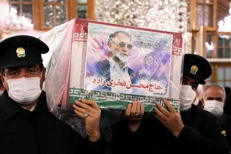 Servants of the holy shrine of Imam Reza carry the coffin of Iranian nuclear scientist Mohsen Fakhrizadeh, in Mashhad