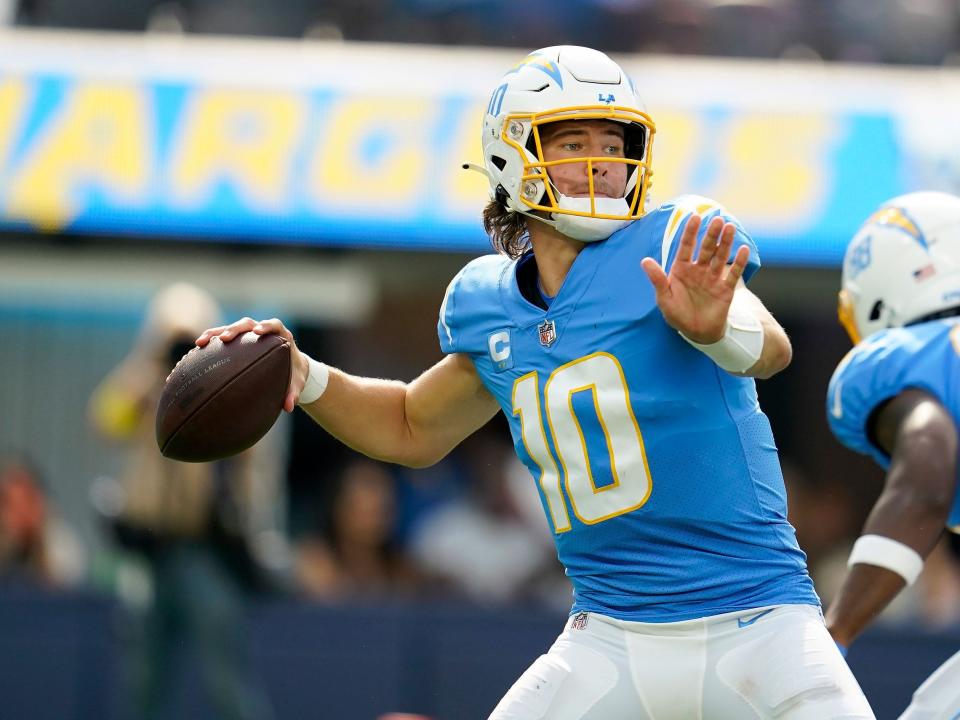 Justin Herbert looks to throw against the Jacksonville Jaguars.