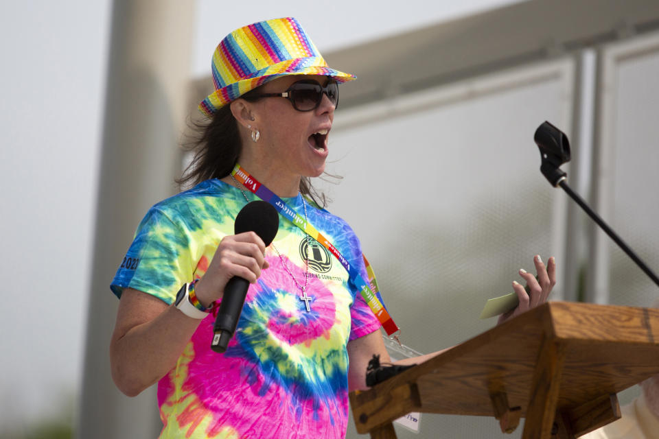 Jessica Robinson, co-chair of Grand Haven Pride Fest gives opening remarks at the Lynne Sherwood Waterfront Stadium in Grand Haven, Mich., on Saturday, June 10, 2023. The festival — which organizers had hoped would attract at least 500 attendees — drew thousands of people from all over who came to experience the first-time event's drag show, dance party and vendor-filled streets. (AP Photo/Kristen Norman)