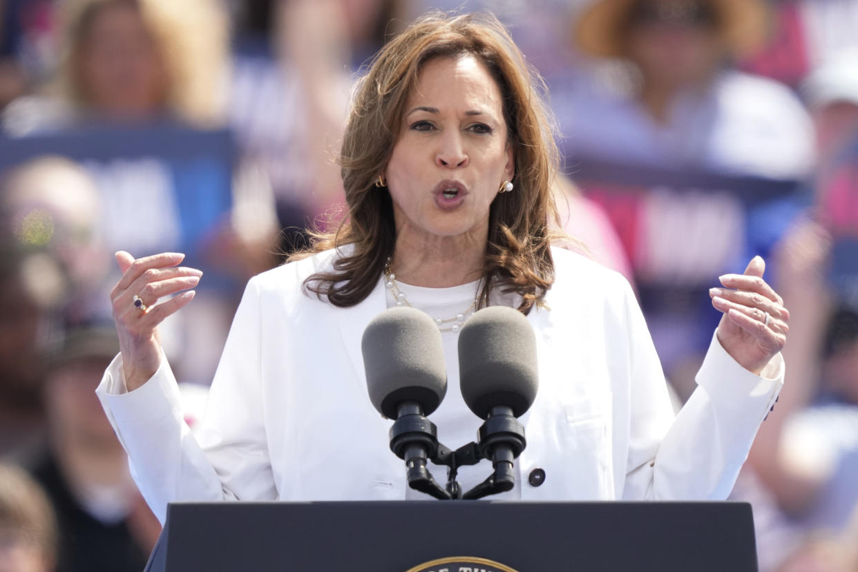 Democratic presidential nominee Vice President Kamala Harris speaks at a podium.