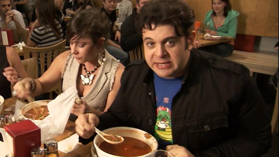 Adam Richman taking on a spicy ramen challenge in Los Angeles, California