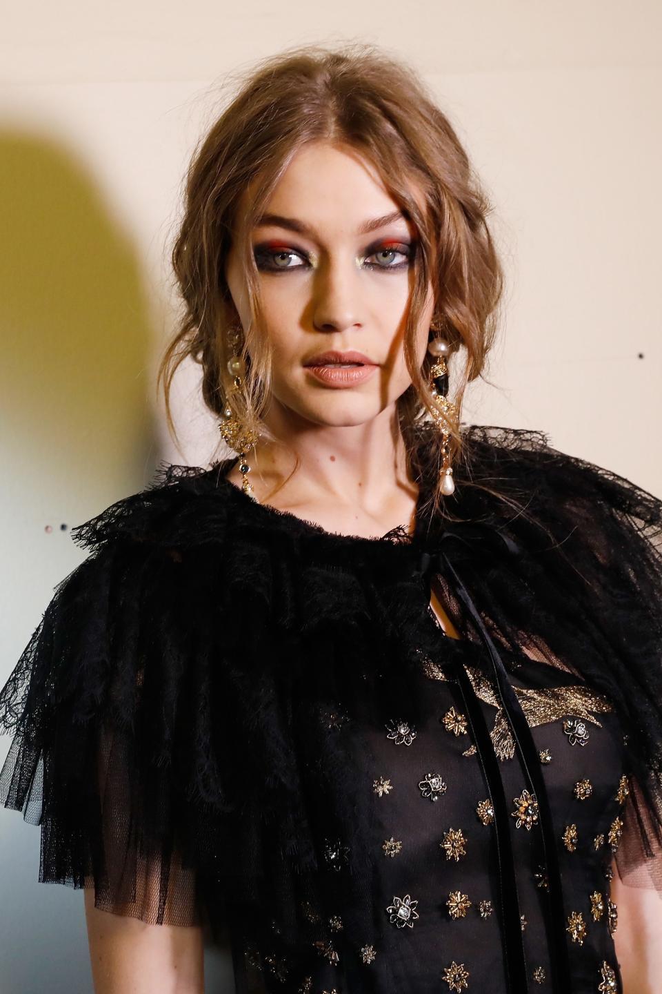 Backstage at Alberta Ferretti fall 2017, makeup artist Tom Pecheux showed us how to make red eye shadow look incredibly sexy.