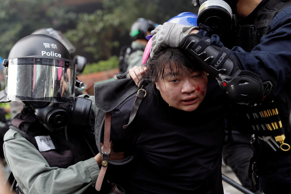 Police detain protesters who attempt to leave the campus of Hong Kong Polytechnic University (PolyU) during clashes with police in Hong Kong, China Nov. 18, 2019. (Photo: Tyrone Siu/Reuters)