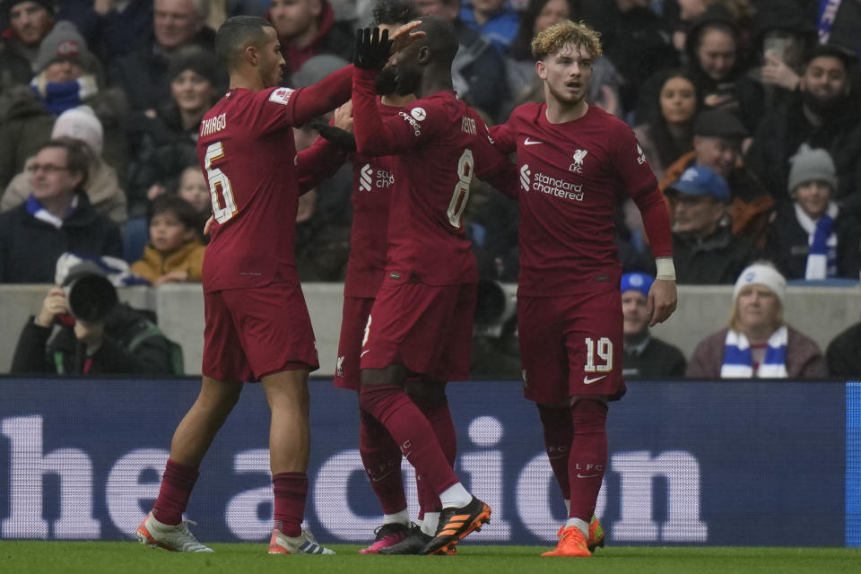 Liverpool's Harvey Elliott, right, celebrates after scoring his side's opening goal during the FA Cup 4th round soccer match between Brighton and Hove Albion and Liverpool at the Falmer Stadium in Brighton, England, Sunday, Jan. 29, 2023. (AP Photo/Alastair Grant)