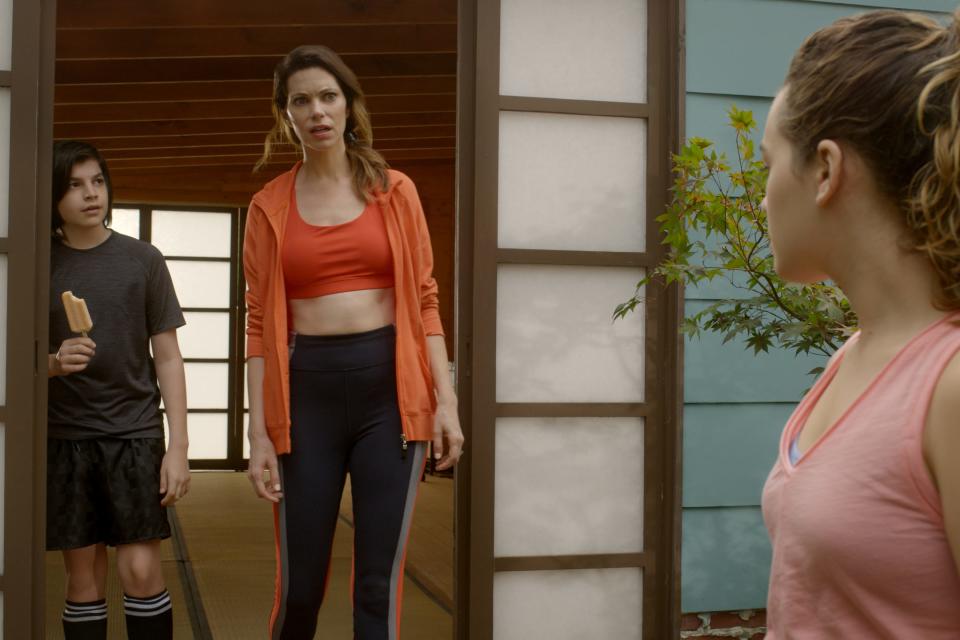 Griffin Santopietro as Anthony LaRusso, Courtney Henggeler, center, as Amanda LaRusso and Mary Mouser as Samantha LaRusso in Season Three of "Cobra Kai."