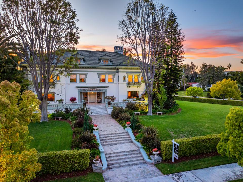 This mansion in a gated part of Fremont Place, within Hancock Park, Los Angeles, used to belong to boxing champion Muhammad Ali. It is up for auction, listed at $13.5 million.