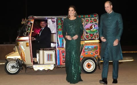 The Duke donned a sherwani coat and matching trousers, while his wife wore a Pakistan-influenced evening dress in the country’s national colour  - Credit: Chris Jackson/REX