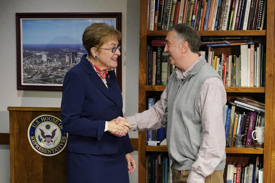 U.S. Rep. Marcy Kaptur, D-Ohio, greets Associated Press correspondent John Seewer before an interview, Friday, Dec. 9, 2022, in Toledo, Ohio. When the new Congress convenes on Tuesday, Rep. Kaptur will become the longest-serving woman in its history. First elected to Congress in 1982, Kaptur will set the mark for the longest tenure by a woman in the House or Senate, surpassing former Sen. Barbara Mikulski, a Maryland Democrat who retired at the end of 2017. (AP Photo/Carlos Osorio)