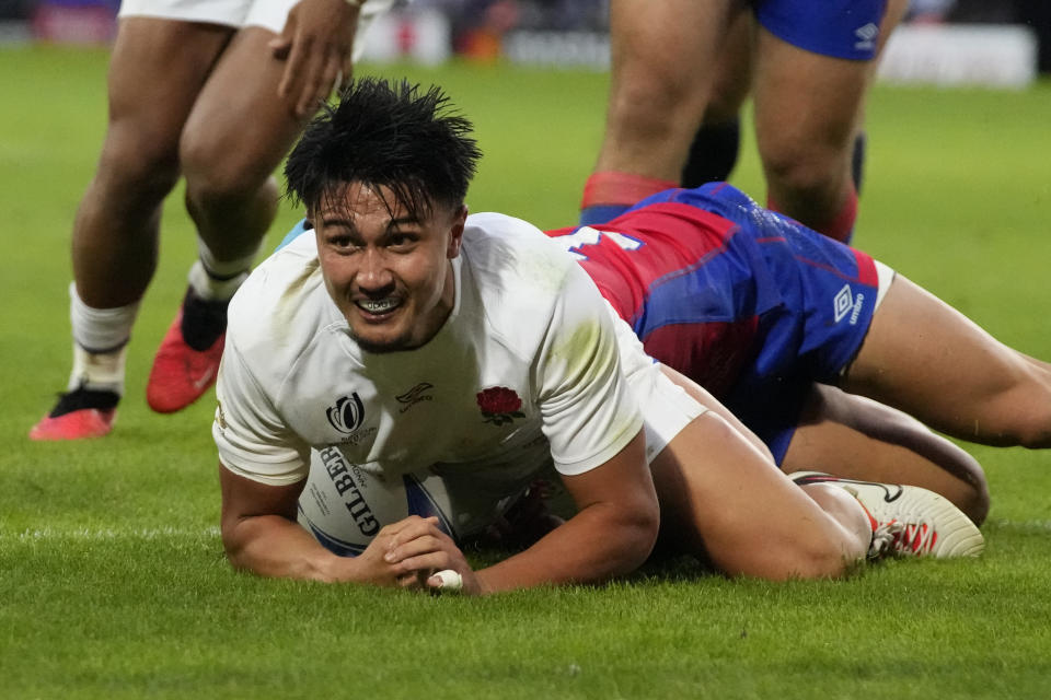 England's Marcus Smith scores a try during the Rugby World Cup Pool D match between England and Chile at the Stade Pierre Mauroy in Villeneuve-d'Ascq, outside Lille, Saturday, Sept. 23, 2023. (AP Photo/Themba Hadebe)