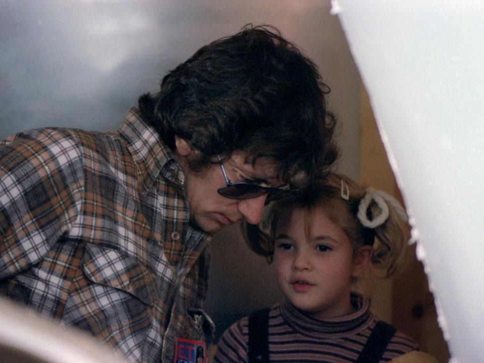 Steven Spielberg and Drew Barrymore on the set of ‘ET’ in the early 1980s (Bruce Mc Broom/Universal/Kobal/Shutterstock)