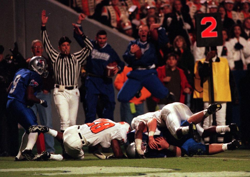 Nov. 9, 1996 - The University of Memphis' Chris Powers clutches the ball after catching a 3-yard touchdown pass with 34 seconds remaining to beat the University of Tennessee 21-17 at Liberty Bowl Memorial Stadium.  Making the tackle too late are UT's Raymond Austin, left, and Al Wilson as the Tigers' Damien Dodson (9) looks on.