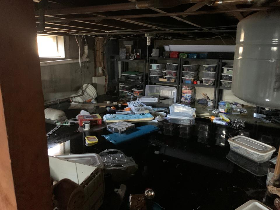An estimated 40 inches of water destroyed much of the contents of Allen Campbell's basement in Johnston, including his art supplies.