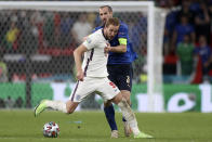 Italy's Giorgio Chiellini vies for the ball with England's Harry Kane, foreground, during the Euro 2020 soccer championship final match between England and Italy at Wembley stadium in London, Sunday, July 11, 2021. (Carl Recine/Pool Photo via AP)
