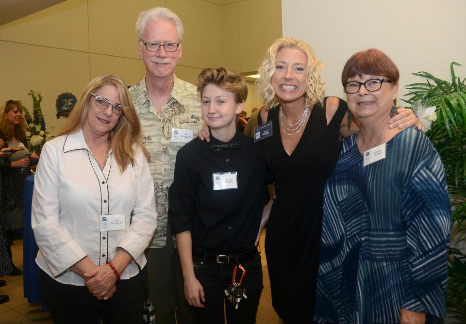 In a photo from 2016, Lisa Matthews, Al Kongsjord, Bailey Wright, Lexi Goza and Nancy Mullen stop for a photo during FLORIDA TODAY's 25th annual Volunteer Recognition Awards at Eastern Florida State College. Mullen, a longtime activist with  PFLAG and the National Organization for Women,  died Nov. 7, 2021.