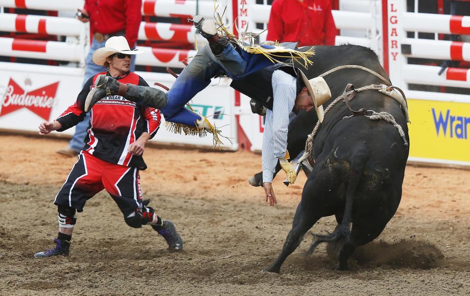 Smith of Fruita, Colorado, flies off the bull Tracker in the bull riding event during day 1 of the rodeo at the 102 Calgary Stampede in Calgary.