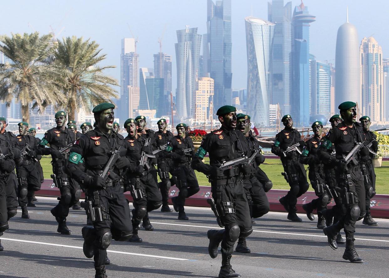 Qatari army special forces take part in a military parade. Qatar was the biggest of the 'not free' donor countries: Getty