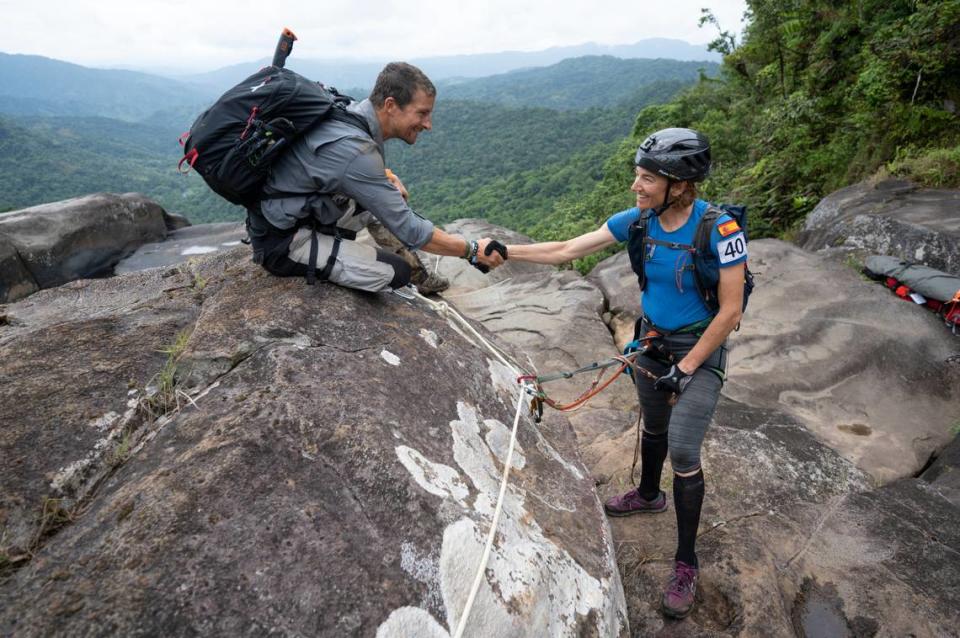 Bear Grylls encourages a competitor during the 2019 Eco-Challenge adventure race in Fiji on Saturday, Sept. 14, 2019. “World’s Toughest Race: Eco-Challenge Fiji premieres on Amazon Prime on Friday, Aug. 14, 2020. 