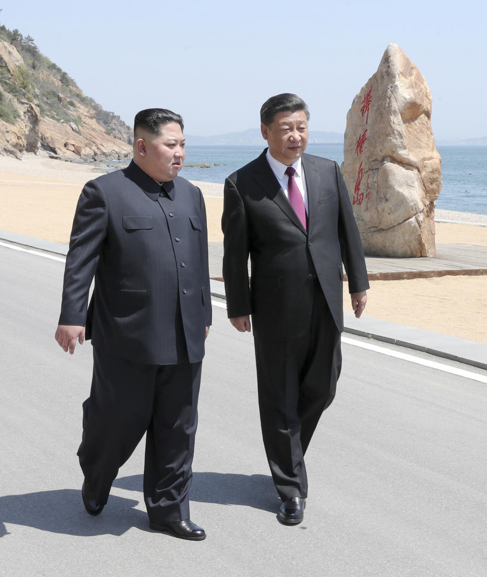 FILE - In this May 7, 2018, file photo released by Xinhua News Agency, Chinese President Xi Jinping, right, walks with North Korean leader Kim Jong Un during a meeting in Dalian in northeastern China's Liaoning Province. For China, concerns about instability in North Korea, its ostensible communist ally, have long overridden worries about its nuclear arsenal. Beijing chiefly fears a collapse of the North Korean economy that could lead to armed conflict within the government and a potential flood of refugees streaming across the rivers that separate the neighbors. (Ju Peng/Xinhua via AP, File)