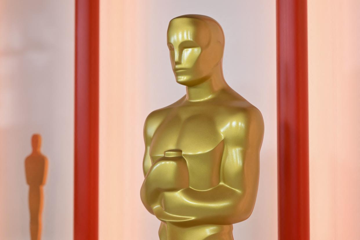 A decorative replica of an Oscar statue stands near the red carpet arrivals area, ahead of the 95th Academy Awards, in Hollywood, California, on March 10, 2023. - The red carpet for the Oscars airing on March 12, 2023, is champagne-color for 2023. (Photo by ANGELA WEISS / AFP) (Photo by ANGELA WEISS/AFP via Getty Images)