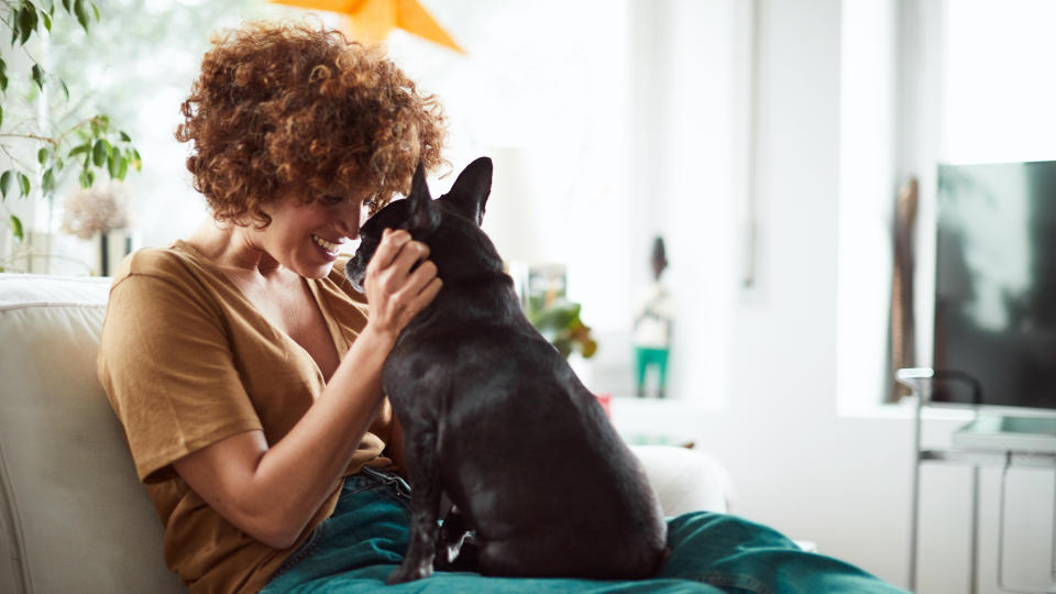 Lady cuddling her dog