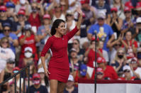 This Oct. 29, 2020 photo shows Anna Paulina Luna, Republican candidate for U.S. House of Representatives waves before President Donald Trump, and First Lady Melania Trump speak at a campaign rally in Tampa, Fla. Court papers show that Luna is seeking a retraining order against William Braddock whom she accuses of stalking her and wanting her dead. Braddock denies the claims and wants to see any evidence against him. A Pinellas County judge on Tuesday, June 22, 2021, agreed to delay the matter until July 9.(AP Photo/Chris O'Meara)