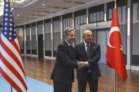 U.S. Secretary of State Antony Blinken, left, shakes hands with Turkish Foreign Minister Mevlut Cavusoglu before their meeting in Ankara, Turkey, Monday, Feb. 20, 2023. (AP Photo/Burhan Ozbilici)