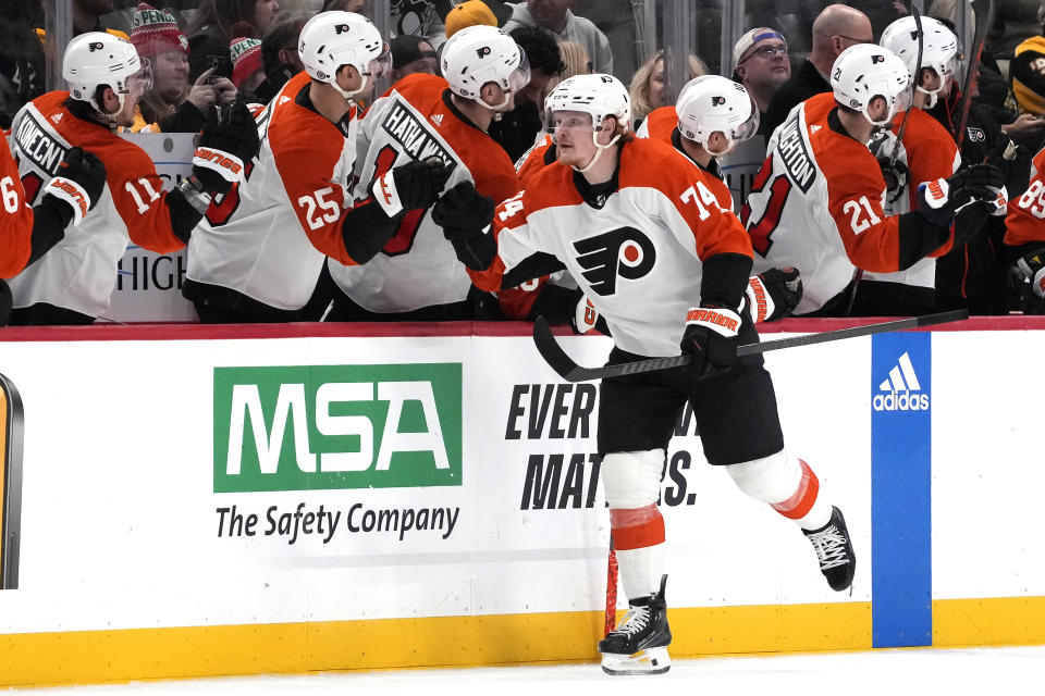 Philadelphia Flyers' Owen Tippett (74) returns to the bench after scoring during the second period of an NHL hockey game against the Pittsburgh Penguins in Pittsburgh, Saturday, Dec. 2, 2023. (AP Photo/Gene J. Puskar)