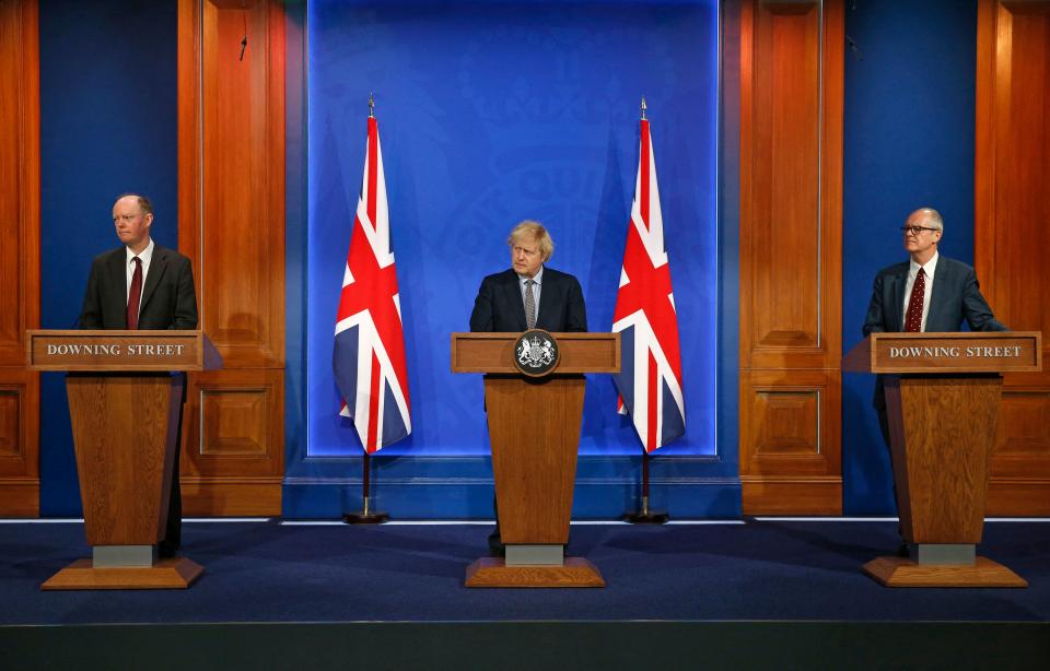 Britain's Chief Medical Officer for England Chris Whitty (L), Britain's Prime Minister Boris Johnson (C) and Britain's Chief Scientific Adviser Patrick Vallance (R) give an update on the coronavirus Covid-19 pandemic during a virtual press conference inside the new Downing Street Briefing Room in central London on March 29, 2021. - England entered the second phase of its lockdown easing on Monday thanks to a successful vaccination drive, but the government is urging vigilance as another wave of coronavirus sweeps Europe. (Photo by Hollie Adams / POOL / AFP) (Photo by HOLLIE ADAMS/POOL/AFP via Getty Images)