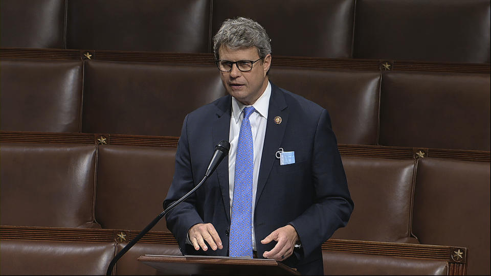 FILE - In this April 23, 2020, image from video, Rep. Bill Huizenga, R-Mich., speaks on the floor of the House of Representatives at the U.S. Capitol in Washington. Huizenga tweeted Wednesday, Oct. 14 that he tested positive for COVID-19 in a rapid test before he was scheduled to appear at a Michigan campaign rally with Vice President Mike Pence. (House Television via AP, File)