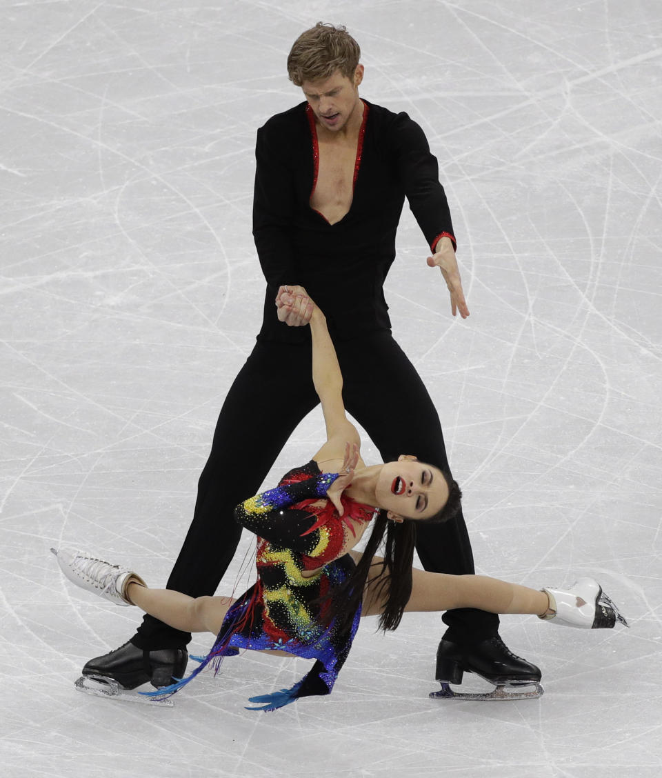<p>Madison Chock and Evan Bates of the United States perform during the ice dance, short dance figure skating in the Gangneung Ice Arena at the 2018 Winter Olympics in Gangneung, South Korea, Monday, Feb. 19, 2018. (AP Photo/David J. Phillip) </p>