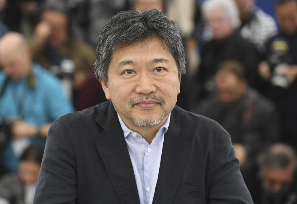 Director Hirokazu Koreeda poses for photographers during a photo call for the film 'Shoplifters' at the 71st international film festival, Cannes, southern France, Monday, May 14, 2018. (Photo by Arthur Mola/Invision/AP)