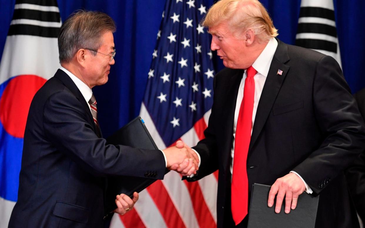 President Moon Jae-in is scheduled to meet Donald Trump next week - AFP