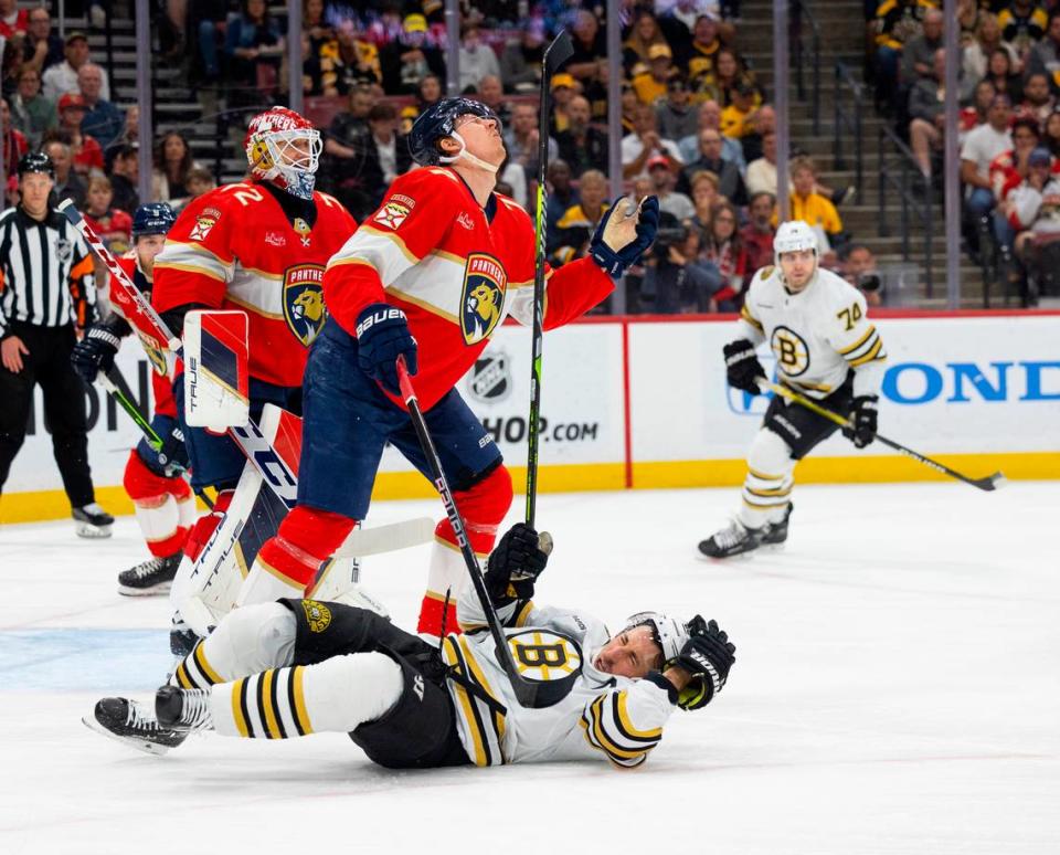 Boston Bruins left wing <a class="link " href="https://sports.yahoo.com/nhl/players/4351/" data-i13n="sec:content-canvas;subsec:anchor_text;elm:context_link" data-ylk="slk:Brad Marchand;sec:content-canvas;subsec:anchor_text;elm:context_link;itc:0">Brad Marchand</a> (63) hits Florida Panthers defenseman <a class="link " href="https://sports.yahoo.com/nhl/players/6869/" data-i13n="sec:content-canvas;subsec:anchor_text;elm:context_link" data-ylk="slk:Niko Mikkola;sec:content-canvas;subsec:anchor_text;elm:context_link;itc:0">Niko Mikkola</a> (77) with his stick during the first period of a game on Tuesday, March 26, 2024, at Amerant Bank Arena in Sunrise, Fla. Alie Skowronski/askowronski@miamiherald.com