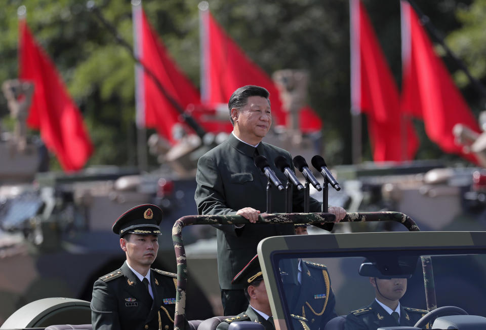 FILE - Chinese President Xi Jinping inspects the People's Liberation Army soldiers at a camp in Hong Kong on June 30, 2017. Xi will visit Hong Kong this week to celebrate the 25th anniversary of the former British colony's 1997 return to China, a state news agency said Saturday, June 25, 2022, in his first trip outside the mainland since the start of the coronavirus pandemic 2 1/2 years ago. (AP Photo/Vincent Yu, File)