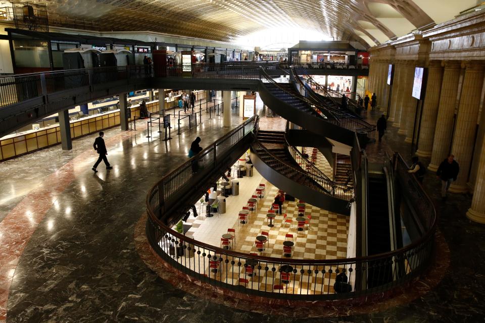 A handful of people walk in Union Station in Washington, D.C., on Monday.