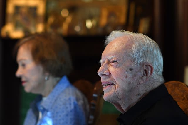 <p>Matt McClain/The Washington Post via Getty</p> Jimmy and Rosalynn Carter have dinner at a friend's home in Plains, Georgia, on Aug. 4, 2018