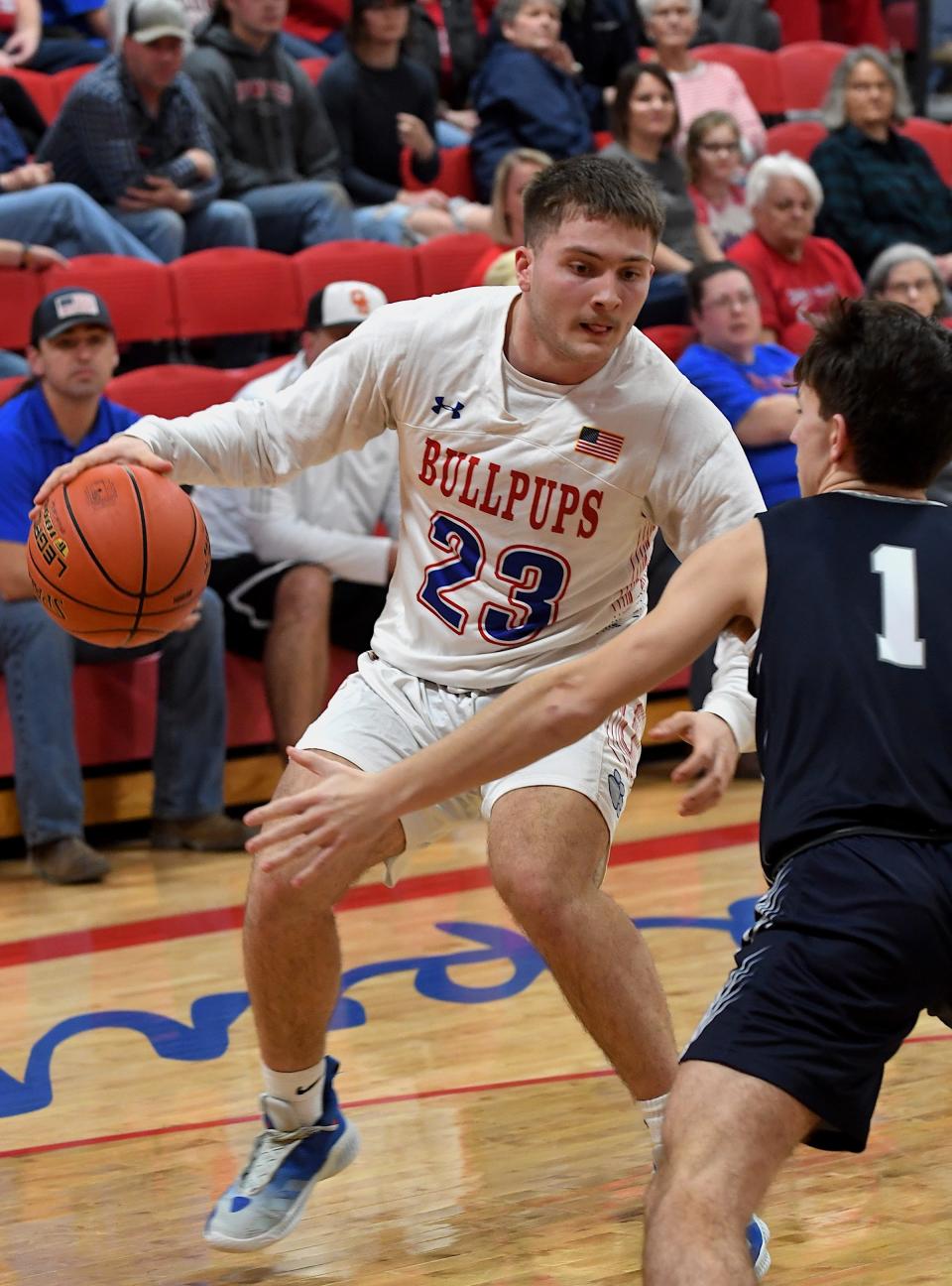 Caney Valley KS High School's senior Jackson Griffin (23) drives the ball during playoff basketball action against Galena in Caney, KS on Feb. 26, 2024.