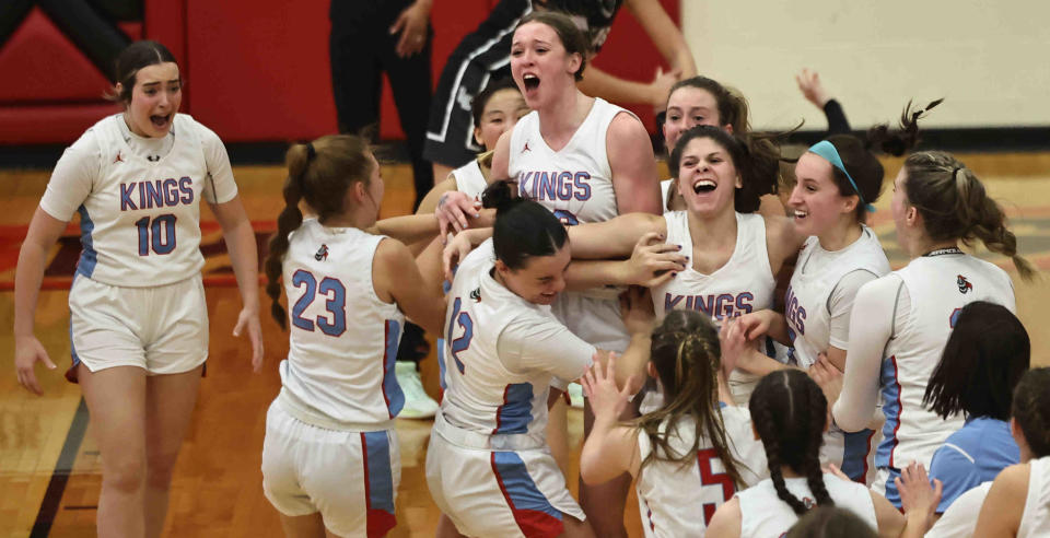 Kings players celebrate after beating Lakota East in the OHSAA Division I regional semifinals to advance to the final Wednesday, March 1, 2023.