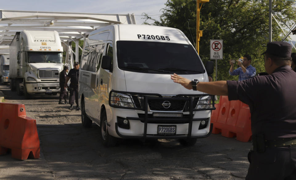 The funeral car carrying the bodies of Óscar Alberto Martínez Ramírez, 25, and his daughter Valeria, 23 months, crosses the border from Guatemala to San Francisco Menendez, El Salvador, Sunday, June 30, 2019. Martínez and Valeria were swept away by the border river between Matamoros, Mexico, and Brownsville, Texas, on Sunday, June 23, and their bodies were found the next morning. The wife and mother, Tania Vanessa Ávalos, survived. (AP Photo/Salvador Melendez)