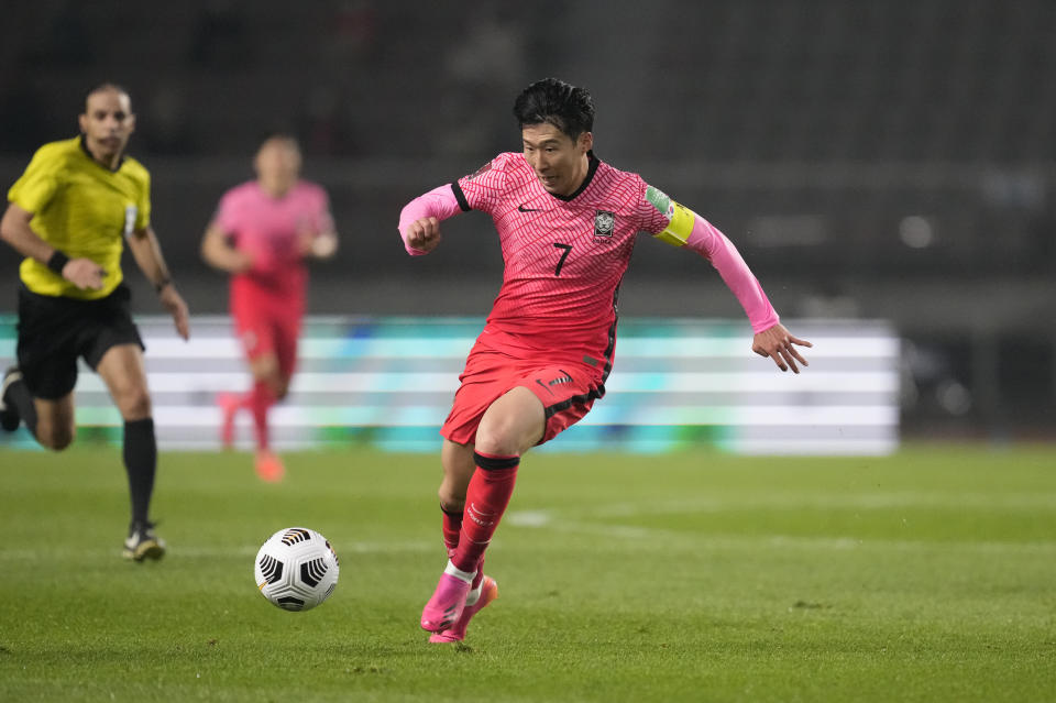 South Korea's Son Heung-min dribbles the ball against Turkmenistan during their Asian zone Group H qualifying soccer match for the FIFA World Cup Qatar 2022 at Goyang stadium in Goyang, South Korea, Saturday, June 5, 2021. (AP Photo/Lee Jin-man)