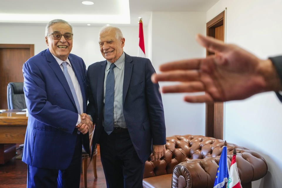 Lebanese Foreign Minister Abdallah Bouhabib, left, shakes hands with European Union foreign policy chief Josep Borrell before their meeting in Beirut, Lebanon, Saturday, Jan. 6, 2024. Borrell said Saturday during a visit to Beirut in an attempt to tamp down tensions on the Lebanon-Israel border that he aims to jumpstart a European-Arab initiative to revive a peace process that would result in a two-state solution to the Israeli-Palestinian conflict. (AP Photo/Hassan Ammar)