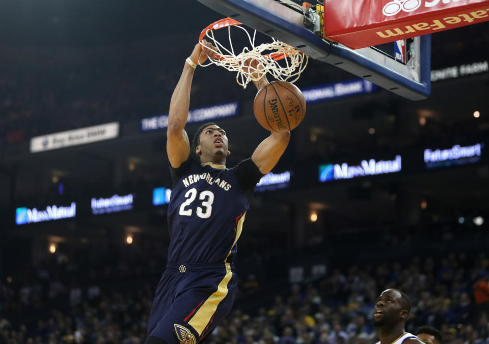 <p>OAKLAND, CA - MARCH 14: Anthony Davis #23 of the New Orleans Pelicans dunks the ball over Draymond Green #23 of the Golden State Warriors at ORACLE Arena on March 14, 2016 in Oakland, California. NOTE TO USER: User expressly acknowledges and agrees that, by downloading and or using this photograph, User is consenting to the terms and conditions of the Getty Images License Agreement. (Photo by Ezra Shaw/Getty Images)</p>