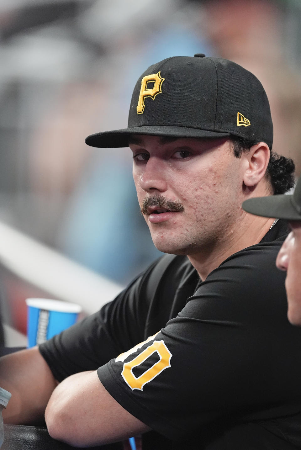 Pittsburgh Pirates starting pitcher Paul Skenes watches from the dugout during a baseball game against the Atlanta Braves Friday, June 28, 2024, in Atlanta. Skenes was not in the lineup. (AP Photo/John Bazemore)