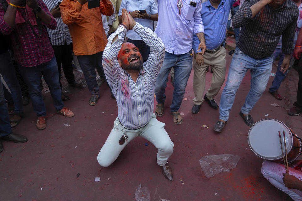 A supporter of Shiv Sena (Uddhav Balasaheb Thackeray) dances as he celebrates with others their party's lead during the counting of votes in India's national election in Mumbai, India, Tuesday, June 4, 2024. (AP Photo/Rafiq Maqbool)