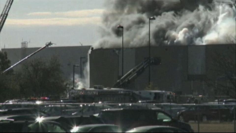 Raw video: A small plane crashed into a building at Wichita Mid-Continent Airport in Wichita, Kan., on Thursday, killing at least four people, authorities said. Photo/video: KAKE News/AP